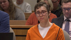 Ezra McCandless stands in court