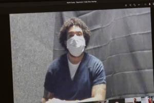 masked man appears on camera