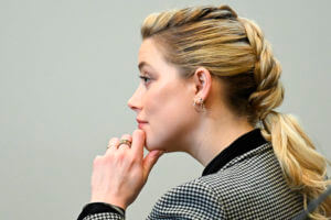 Actor Amber Heard listens in the courtroom