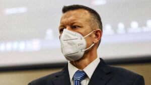 Paul Flores wears a maskl