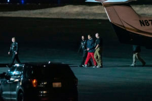 Bryan Kohberger is escorted by law enforcement after arriving at Pullman-Moscow Regional Airport
