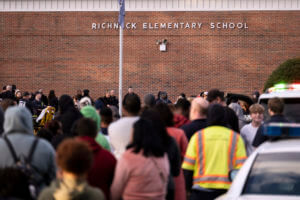 Students and police gather outside of Richneck Elementary