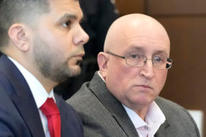 Robert E. Crimo Jr., right, and his attorney George Gomez, appear before Judge George D. Strickland