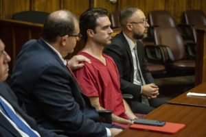 Attorney Phillip Reizenstein places his hand on the shoulder of telenovela star Pablo Lyle as the sentence is read