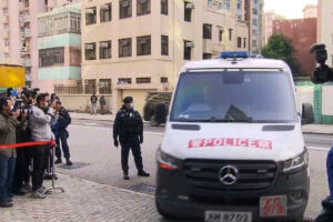 a police van believed to be carrying relatives of murdered model Abby Choi