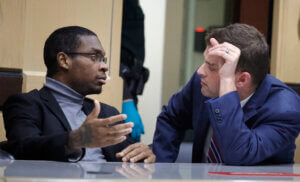 Shooting suspect Michael Boatwright talks to his attorney Joseph Kimok