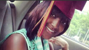 Shanquella Robinson wearing a graduation hat