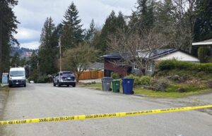 Crime scene tape surrounds a home in Redmond, Wash