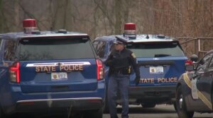 Police outside abandoned Michigan facility where Kayla Sedoskey's body was found.