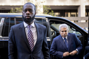 Prazkazrel 'Pras' Michel enters court with his attorney