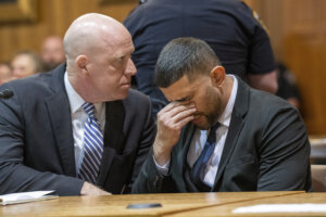 Nauman Hussain, right, sitting with his attorney Lee Kindlon, reacts as the verdict is read
