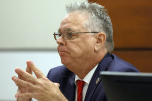 Scot Peterson sits at the counsel table during his trial.