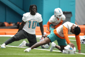Tyreek Hill (10) stretches during practice at the NFL football team's training facility