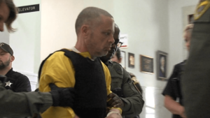 Richard Allen, wearing a bullet proof vest and yellow jumpsuit, appeared in court