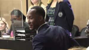 Travis Rudolph smiles in court after his acquittal
