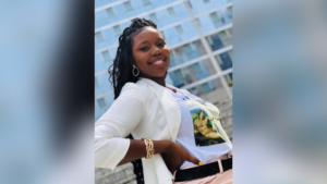 Photo of Carlee Russell, wearing a white jacket and smiling