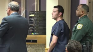 Brandon Labiner listens as his attorney, Val Rodriguez, speaks to a Palm Beach County judge