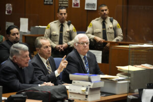 Judge Jeffrey Ferguson, right, sits next to his attorneys John Drummond Barnett, left, and Paul Meyer during a hearing