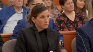 Kouri Richins sits in court at her counsel table.