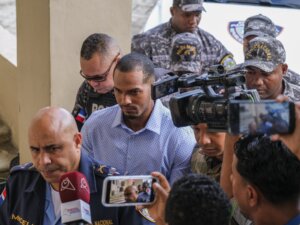 Wander Franco, center, is escorted by police to court