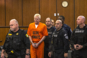 Alex Murdaugh is led into court with shackles