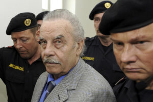 Josef Fritzl, center, is escorted to the fourth day of his trial