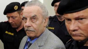 Josef Fritzl, center, is escorted to the fourth day of his trial