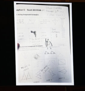 Photo of paper with writing on it