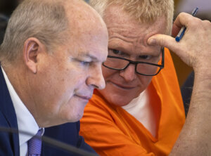 Alex Murdaugh talks to his attorney in court