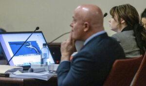 Defendant Hannah Gutierrez-Reed, right, armorer on the set of the movie "Rust', listens as FBI forensic examiner Bryce Ziegler testifies
