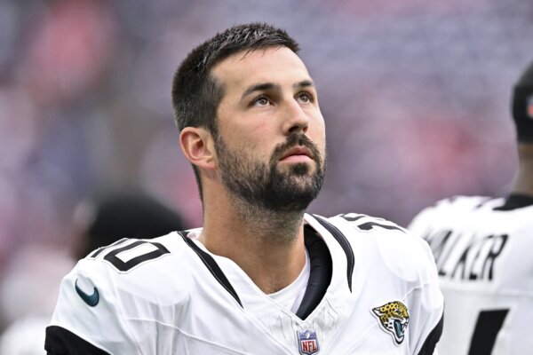 Brandon McManus stands on the sideline