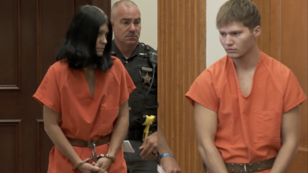 a woman and man appear in court