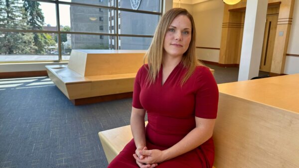 woman sits in lobby of courthouse