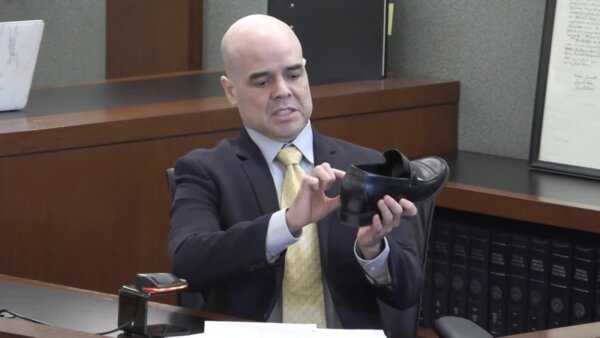man points to show in court