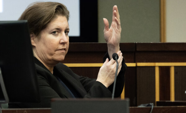 Sarah Boone describes Jorge Torres Jr.'s hand coming out of the suitcase