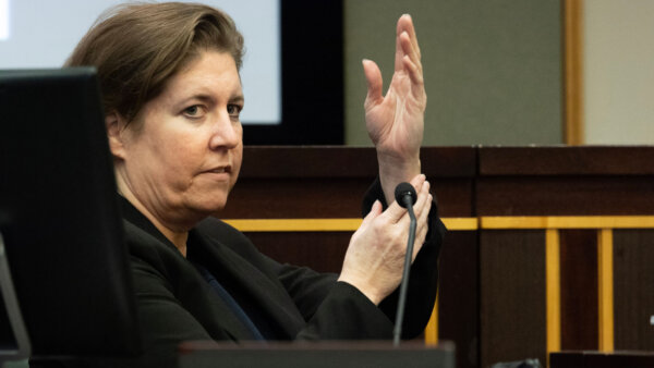 Sarah Boone describes Jorge Torres Jr.'s hand coming out of the suitcase