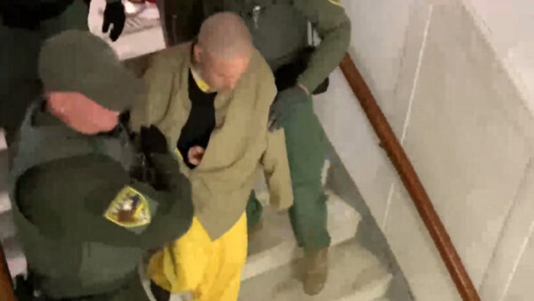 richard allen is escorted by police