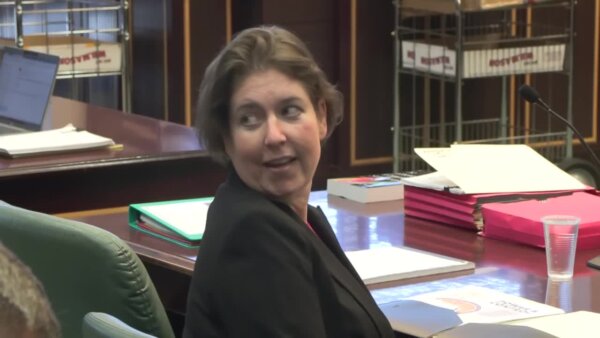 Sarah Boone looks over her shoulder in court