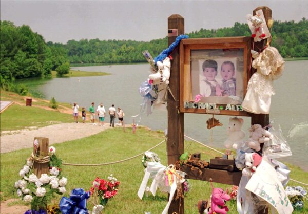 photos of children in memorial near lake