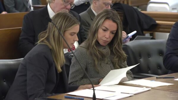 Karen Read and attorney sit in court