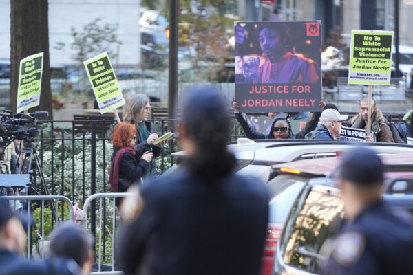 People holding signs outside courthouse