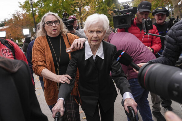 Joan VanderMolen, center, arrives at a courthouse