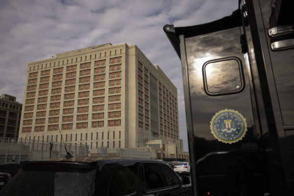 An FBI truck is parked outside the Metropolitan Detention Center