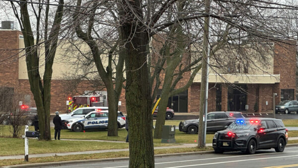Emergency vehicles are parked outside the Abundant Life Christian School