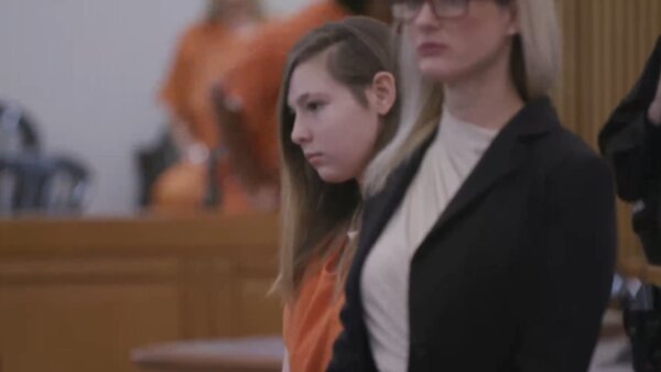 Kendall Mims stands next to her attorney