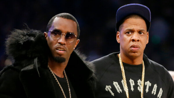 Sean "Diddy" Combs, left, and Jay-Z attend the NBA All-Star basketball game