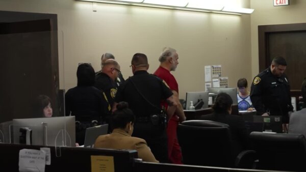 Brad Simpson enters court
