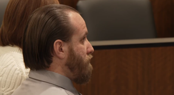 Kevin Ellis sits in court