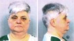head on and profile mugshots of a grey-haired woman in a green and white striped prison jumper.