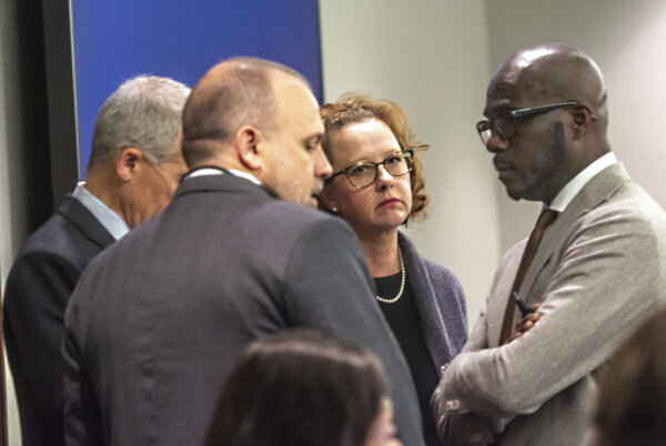 Former District Attorney Jackie Johnson, second from right, stands with her defense attorneys in court